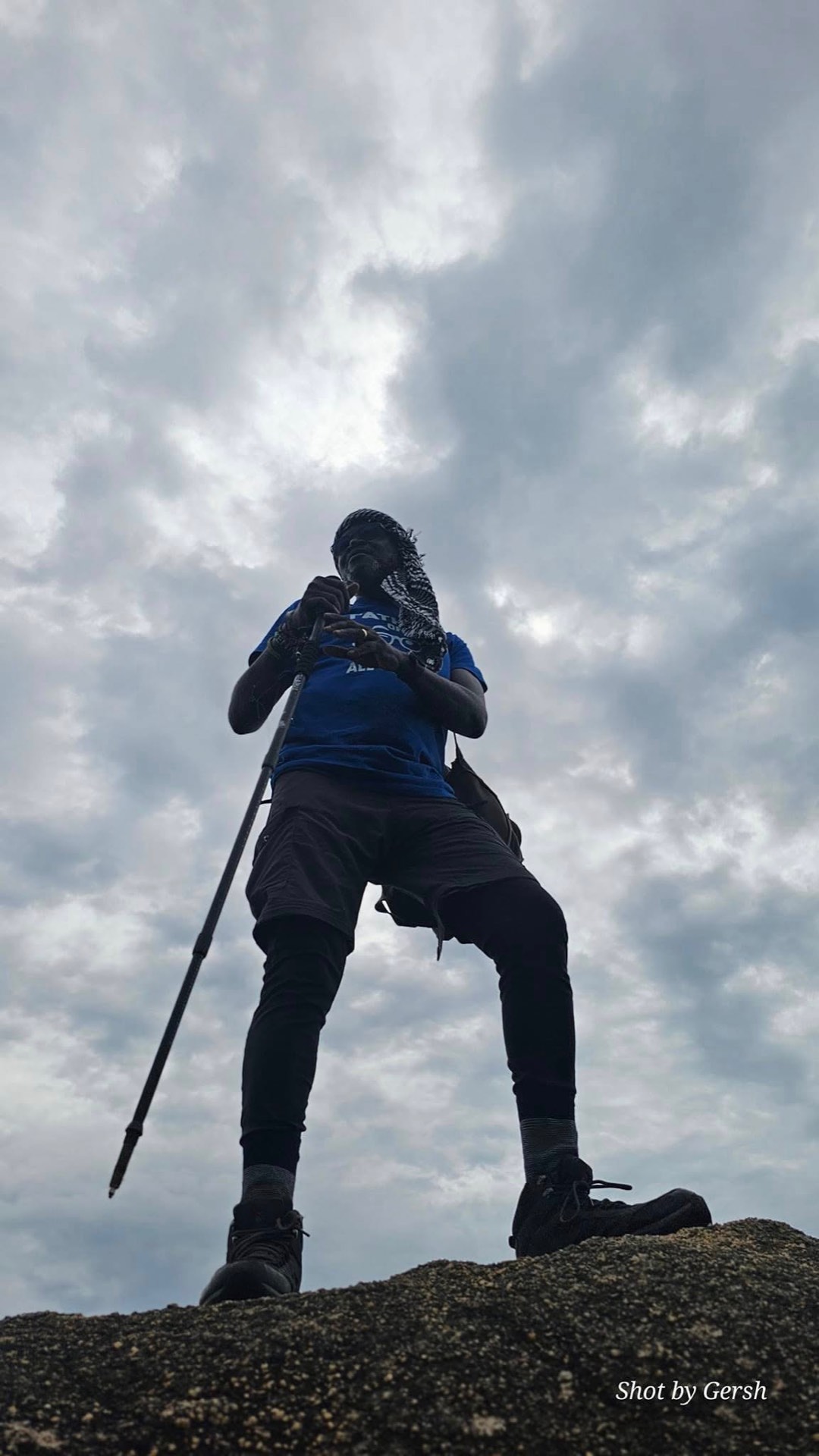 Hiking, framed against the sky